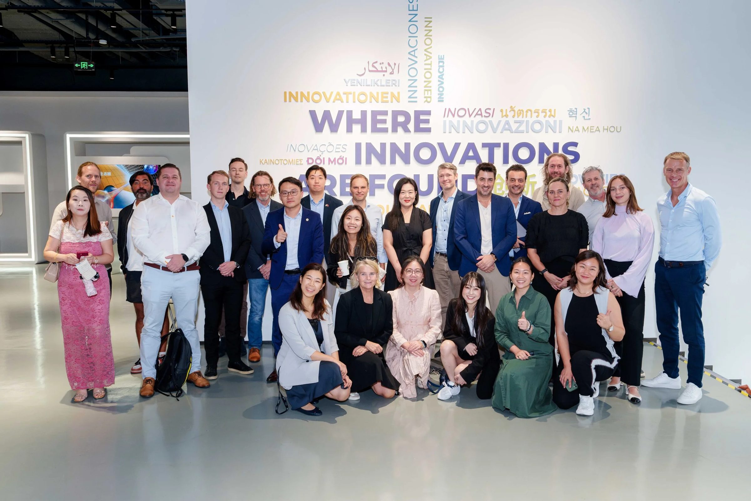 The delegation in front of the innovation wall on the Shenzhen company visit